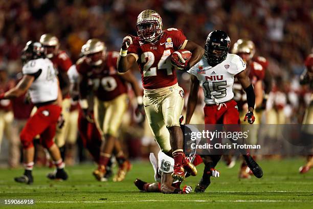 Lonnie Pryor of the Florida State Seminoles scores a 37-yard rushing touchdown in the fourth quarter against the Northern Illinois Huskies during the...