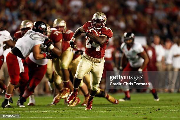 Lonnie Pryor of the Florida State Seminoles scores a 37-yard rushing touchdown in the fourth quarter against the Northern Illinois Huskies during the...