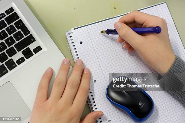 Pupil working at a lap-top during a lesson at the Heinrich-Mann-School in the Neukoelln district of Berlin, Germany on November 07, 2012.