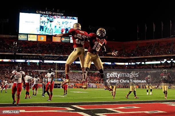 Rashad Greene and Greg Dent of the Florida State Seminoles celebrate after Greene scored a 6-yard touchdown reception in the second quarter against...
