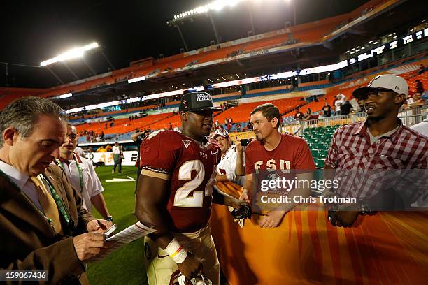 Orange Bowl MVP Lonnie Pryor of the Florida State Seminoles walks off of the field after they won 31-10 against the Northern Illinois Huskies during...