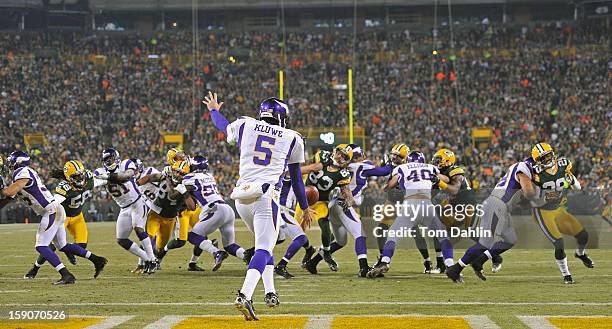 Chris Kluwe of the Minnesota Vikings punts during an NFL game against the Green Bay Packers at Lambeau Field, January 5, 2013 in Green Bay, Wisconsin.