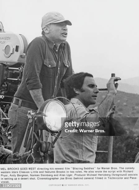 American film director and screenwriter Mel Brooks on the set of his latest film 'Blazing Saddles' in the desert, USA, circa 1974. Producer Michael...