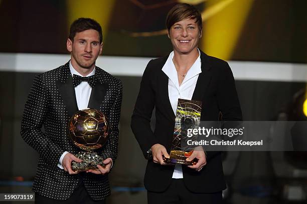 Lionel Messi of Argentina receives the FIFA Ballon d'Or 2012 trophy and Abby Wambach of United States receives her FIFA womens player of the year...