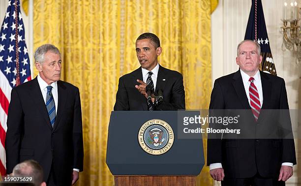 President Barack Obama, center, stands with his nominee for Secretary of Defense Chuck Hagel, left, a former Republican Senator from Nebraska, and...