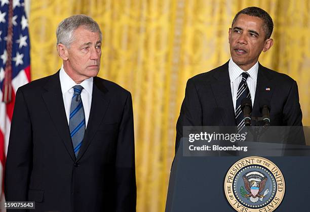 President Barack Obama, right, speaks as his nominee for Secretary of Defense Chuck Hagel, a former Republican Senator from Nebraska, listens, during...