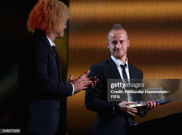 Miroslav Stoch of Slovakia receives the FIFA Puskas Award 2012 from Carlos Valderrama during the FIFA Ballon d'Or Gala 2012 at the Kongresshaus on...