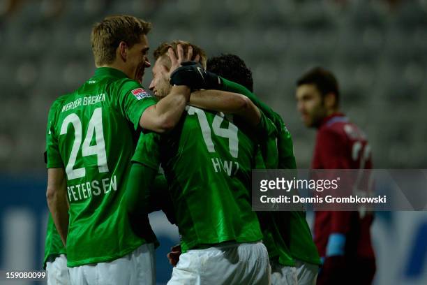 Aaron Hunt of Bremen celebrates with teammates during a friendly match between Werder Bremen and Trabzonspor at day three of the Werder Bremen...