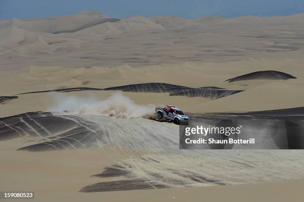 Giniel De Villiers and co-pilot Dirk Von Zitzewitz of team Toyota compete during the stage from Pisco to Nazca on day three of the 2013 Dakar Rally...