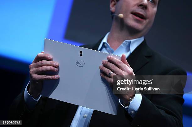 Kirk Skaugen, Intel Vice President, General Manager PC Client Group, holds a prototype of a new Fourth Generation Intel Ultrabook during an Intel...