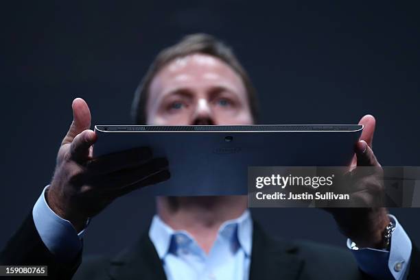 Kirk Skaugen, Intel Vice President, General Manager PC Client Group, holds a prototype of a new Fourth Generation Intel Ultrabook during an Intel...