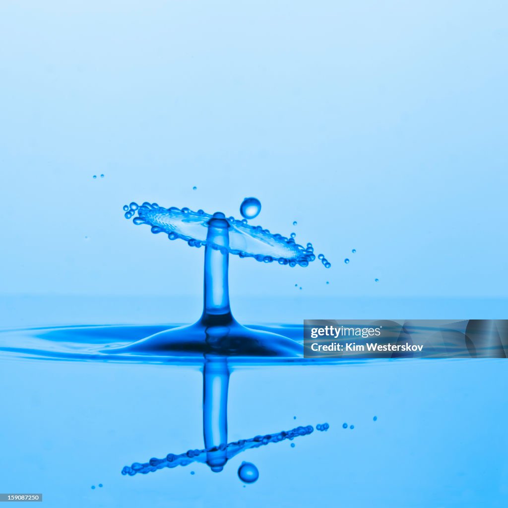 Water drop collision and ripples, blue