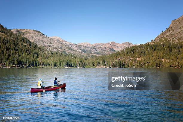 couple canoeing on fallen leaf lake - サウスレイクタホ ストックフォトと画像