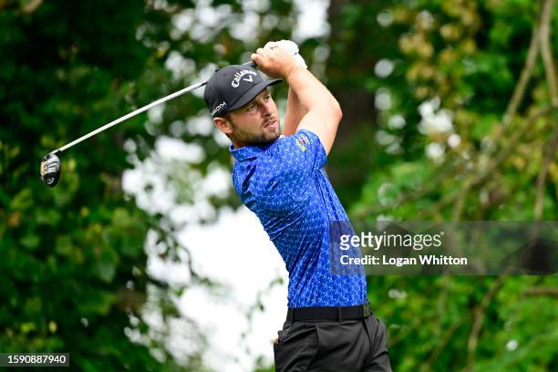 Adam Svensson of Canada plays his shot from the 13th tee during the first round of the Wyndham Championship at Sedgefield Country Club on August 03,...