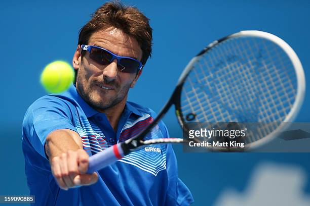 Tommy Robredo of Spain plays a backhand in his first round match against John Millman of Australia during day three of Sydney International at Sydney...