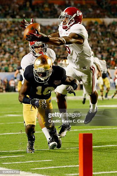 Ha'Sean Clinton-Dix of the Alabama Crimson Tide intercepts a pass intended for DaVaris Daniels of the Notre Dame Fighting Irish in the third quarter...