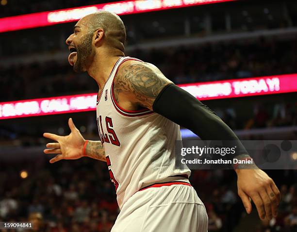 Carlos Boozer of the Chicago Bulls celebrates a three-point play against the Cleveland Cavaliers at the United Center on January 7, 2013 in Chicago,...