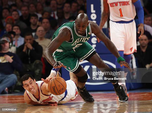 Pablo Prigioni of the New York Knicks and Kevin Garnett of the Boston Celtics struggle for a loose ball at Madison Square Garden on January 7, 2013...