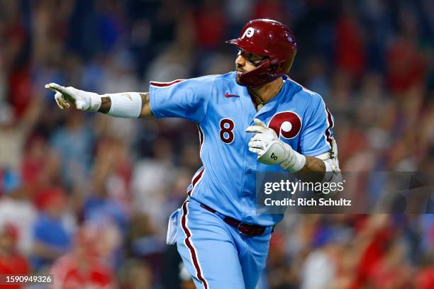 Nick Castellanos of the Philadelphia Phillies points to his teammates after he hit a two-run homer against the Washington Nationals during the...