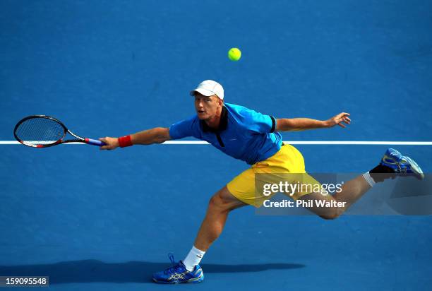 Daniel King-Turner of New Zealand plays a forehand in his first round match against Jesse Levine of Canada during day two of the Heineken Open at the...