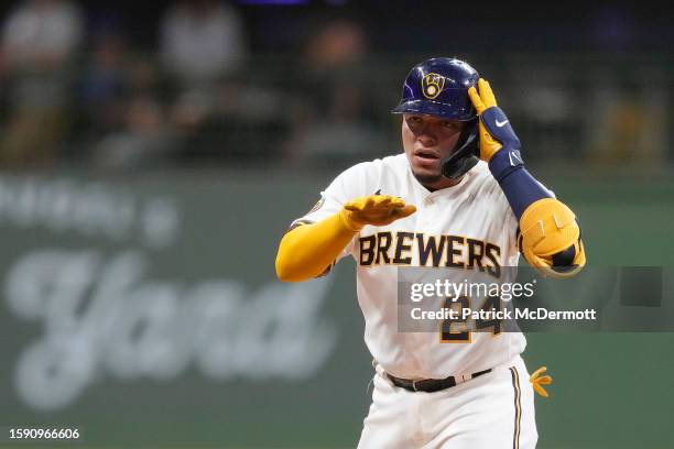 William Contreras of the Milwaukee Brewers celebrates after hitting a two-run RBI double in the seventh inning against the Pittsburgh Pirates at...