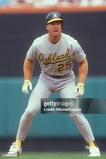 Mark McGwire of the Oakland Athletics leads off first base during a baseball game against the Baltimore Orioles on August 19, 1990 at Memeorial...