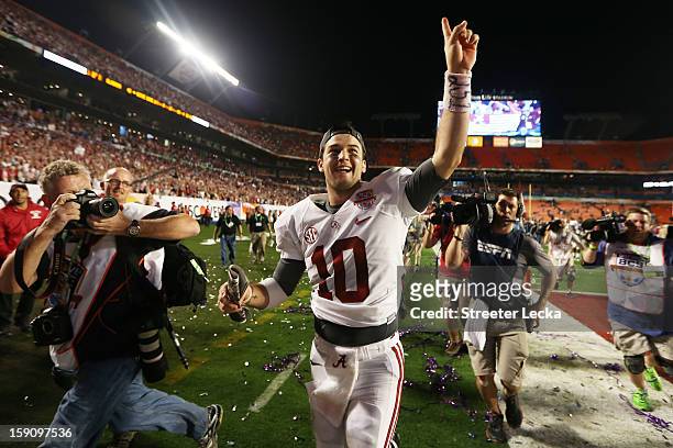 McCarron of the Alabama Crimson Tide celebrates after defeating the Notre Dame Fighting Irish by a score of 42-14 to win the 2013 Discover BCS...