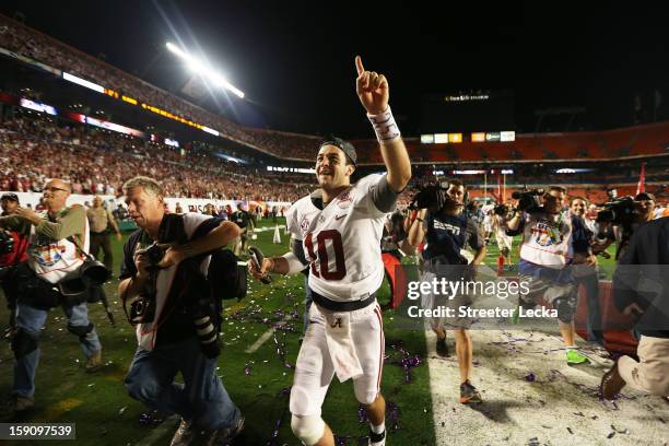 McCarron of the Alabama Crimson Tide celebrates after defeating the Notre Dame Fighting Irish by a score of 42-14 to win the 2013 Discover BCS...