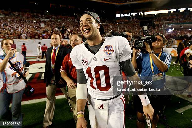 McCarron of the Alabama Crimson Tide celebrates after defeating the Notre Dame Fighting Irish by a score of 42-14 to win the 2013 Discover BCS...