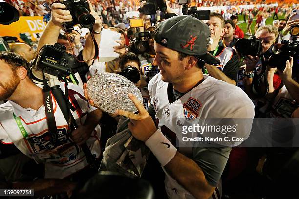 McCarron of the Alabama Crimson Tide celebrates with the Coach's Trophy after defeating the Notre Dame Fighting Irish by a score of 42-14 to win the...