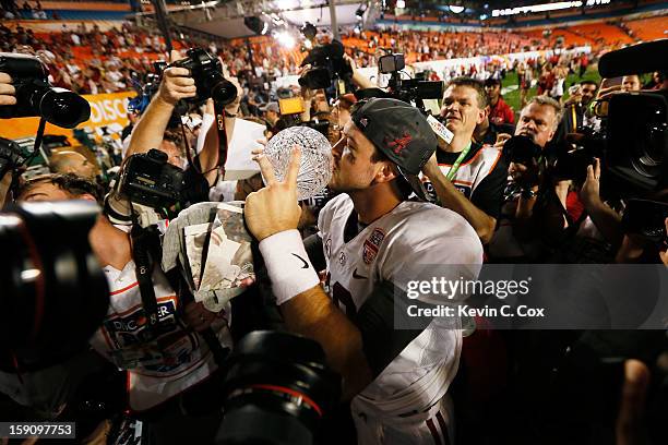 McCarron of the Alabama Crimson Tide celebrates with the Coach's Trophy after defeating the Notre Dame Fighting Irish by a score of 42-14 to win the...