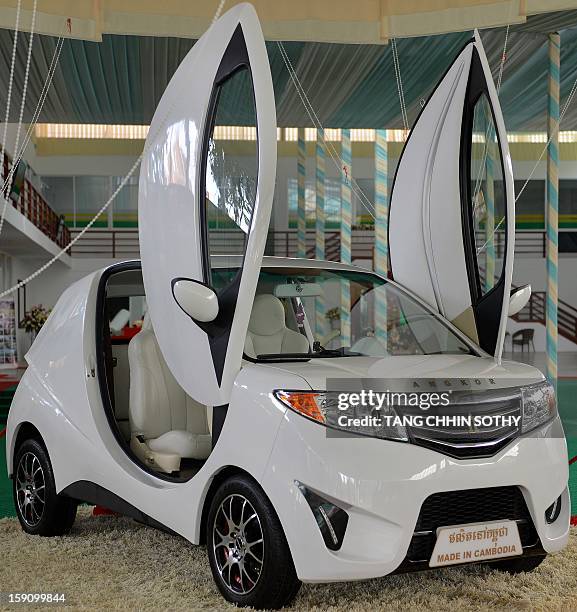 Locally made electric car "Angkor EV 2013" sits on display at a showroom in Phnom Penh on January 8, 2013. Cambodia's Heng Development Company has...