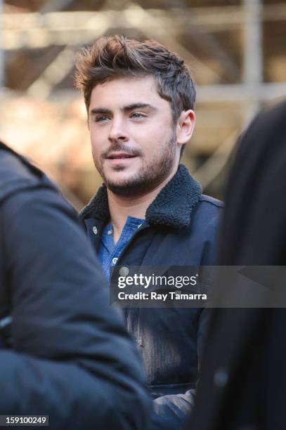 Actor Zac Efron walks to the "Are We Officially Dating?" movie set in Grammercy Park on January 7, 2013 in New York City.