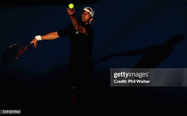 Benjamin Becker of Germany serves in his first round match against Gael Monfils of France during day two of the Heineken Open at the ASB Tennis...