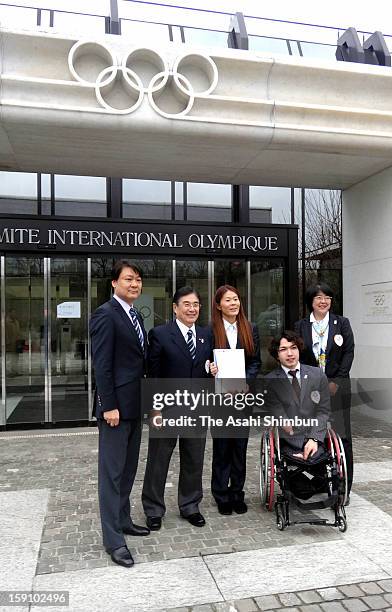 Female Soccer player Homare Sawa , Paralympic swimmer Takayuki Suzuki and Tokyo 2020 Olympic Games bidding committee CEO Masato Mizuno pose for...