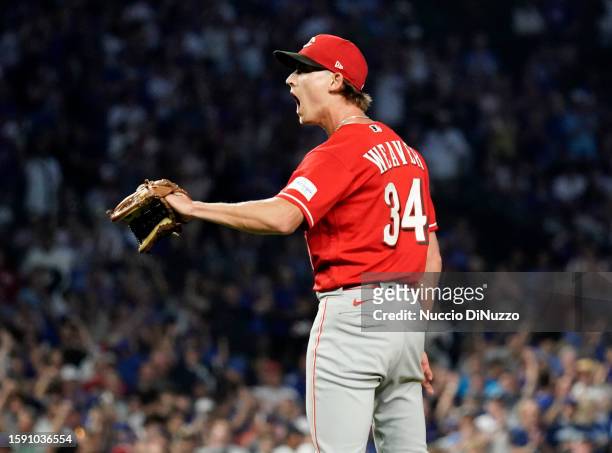 Luke Weaver of the Cincinnati Reds reacts after walking Jeimer Candelario of the Chicago Cubs during the third inning of a game at Wrigley Field on...