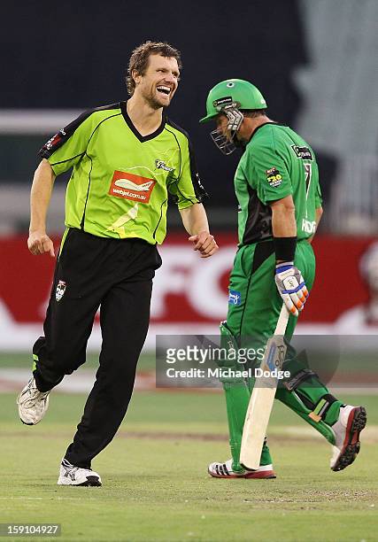 Dirk Nannes of The Sydney Thunder celebrates his dismissal of Brad Hodge during the Big Bash League match between the Melbourne Stars and the Sydney...