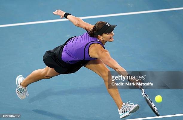 Chanelle Scheepers of South Africa plays a forehand volley in her second round match against Mona Barthel of Germany during day five of the Hobart...