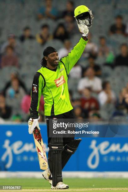 Chris Gayle of the Thunder celebrates his half century during the Big Bash League match between the Melbourne Stars and the Sydney Thunder at...