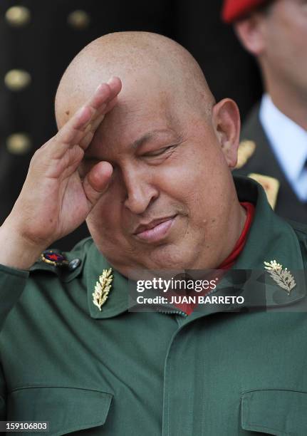 Venezuelan President Hugo Chavez gestures after a meeting with Belarus' Assistant to the President for Special Commissions, Viktor Sheiman, at...