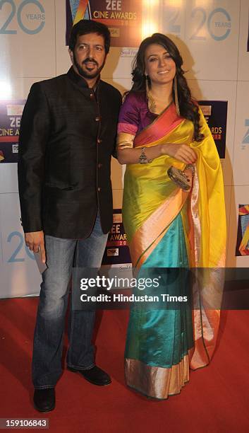 Indian bollywood director Kabir Khan with his wife Mini Mathur attending Zee Cine Awards 2013 at Yash Raj Studio on January 6, 2013 in Mumbai, India.