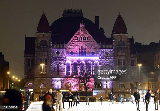 Light installation illuminates the National Theater during the Lux Helsinki festival in Helsinki, Finland on January 7, 2013. Thirteen light...