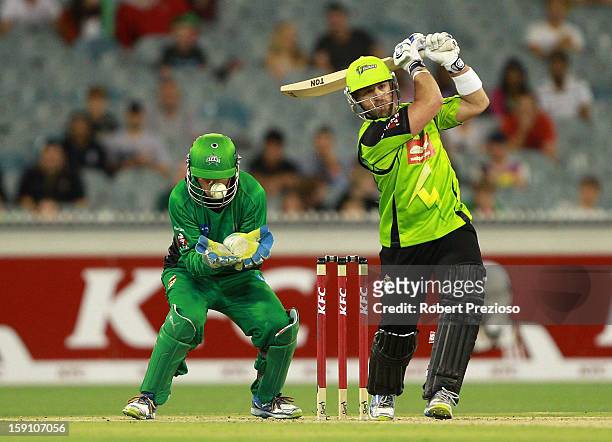 Wicket Keeper Rob Quiney of the Stars is struck by the ball as Matt Prior of the Thunder attempts to play a shot during the Big Bash League match...