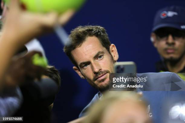 Andy Murray of Great Britain poses for photo with his fans after announcing his withdrawal due to an abdominal strain, ahead of his third round match...