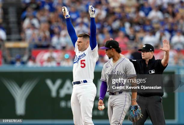 Freddie Freeman of the Los Angeles Dodgers celebrates his double against the Colorado Rockies in the second inning at Dodger Stadium on August 10,...