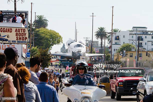 the space shuttle moves through los angeles - police motorbike stock pictures, royalty-free photos & images