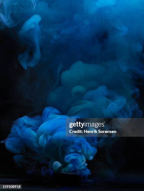 blue smoke - colored smoke stock pictures, royalty-free photos & images