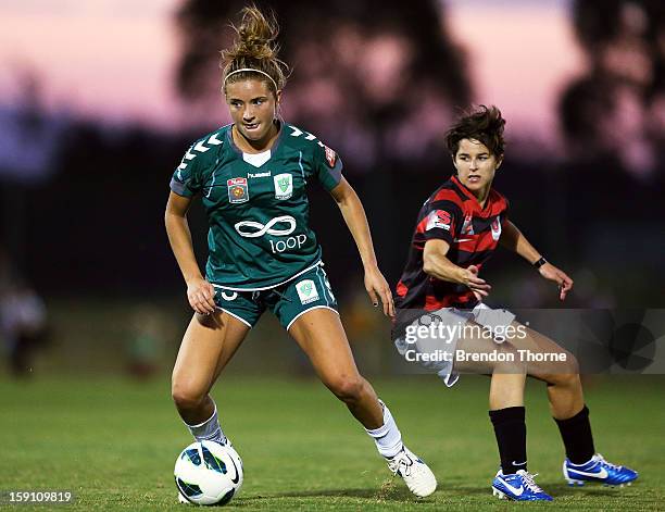 Kristen Mewis of Canberra competes with Sarah Walsh of the Wanderers during the round 11 W-League match between Canberra United and the Western...