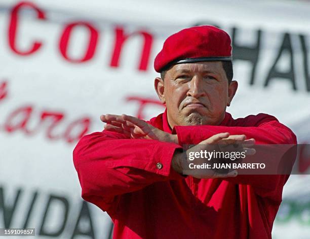 Venezuelan President Hugo Chavez gestures during a demonstration in Caracas 23 August 2003, celebrating his second three-year government .