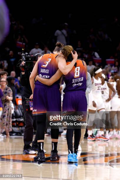 Guard Diana Taurasi of the Phoenix Mercury hugs guard Moriah Jefferson after scoring her 10,000th career point during the second half against the...